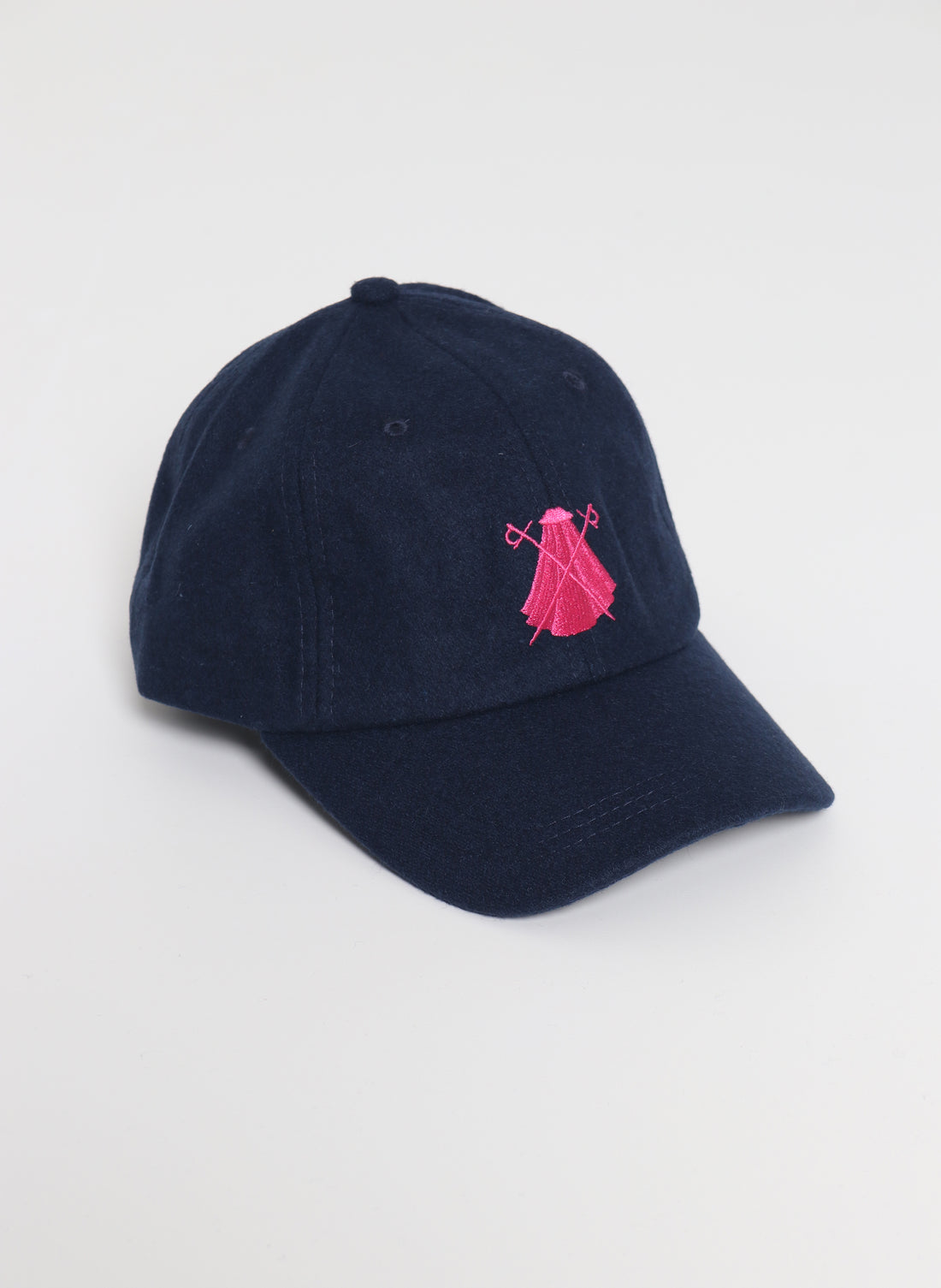 Marineblauwe wollen muts met roze logo Capote