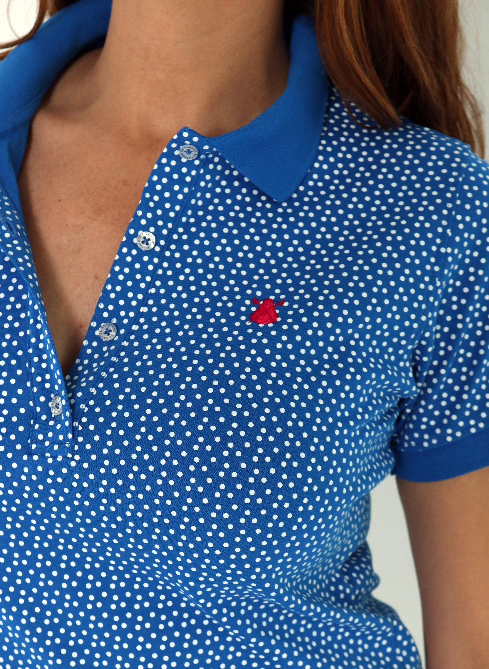 Elektrisches blaues Tupfen-Poloshirt der Frauen