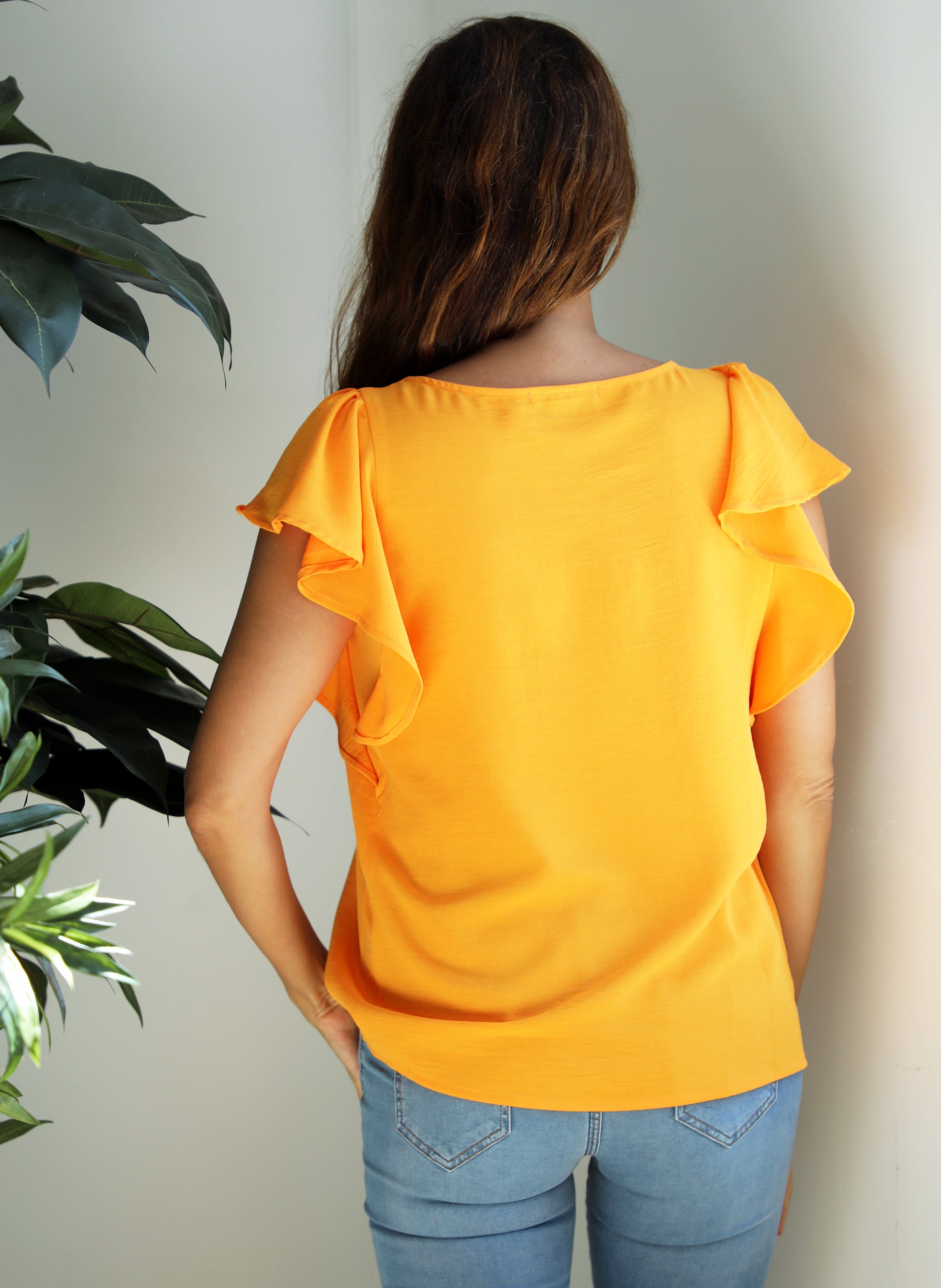 Oranje blouse met korte mouwen en ruches
