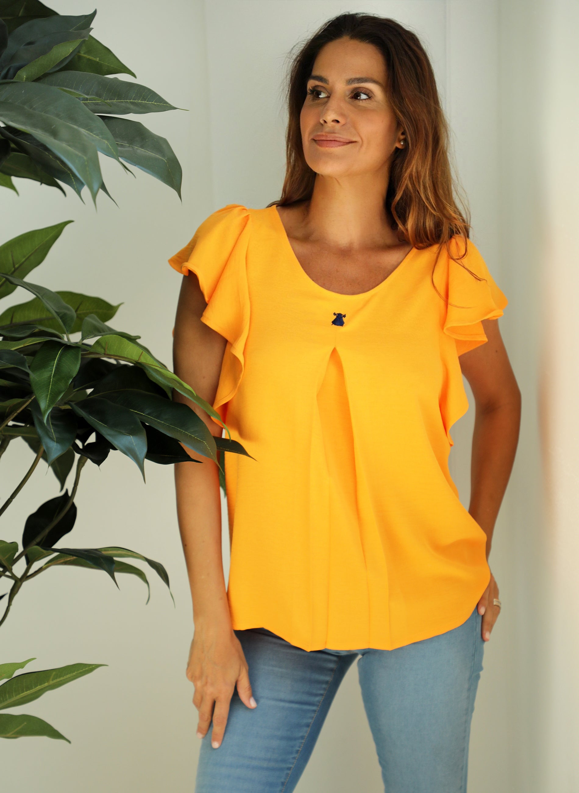 Oranje blouse met korte mouwen en ruches